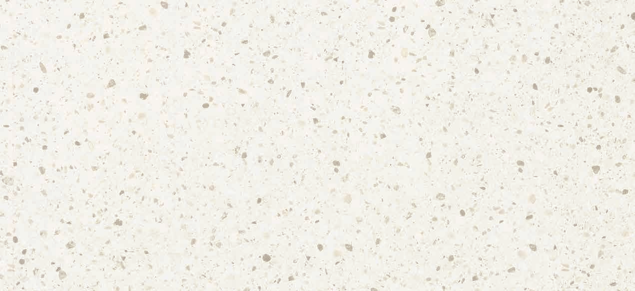 A close-up of a White 1611 GL Vogue Light Chips  with a Glossy finish Decorative Laminate available at Material Depot in Bangalore