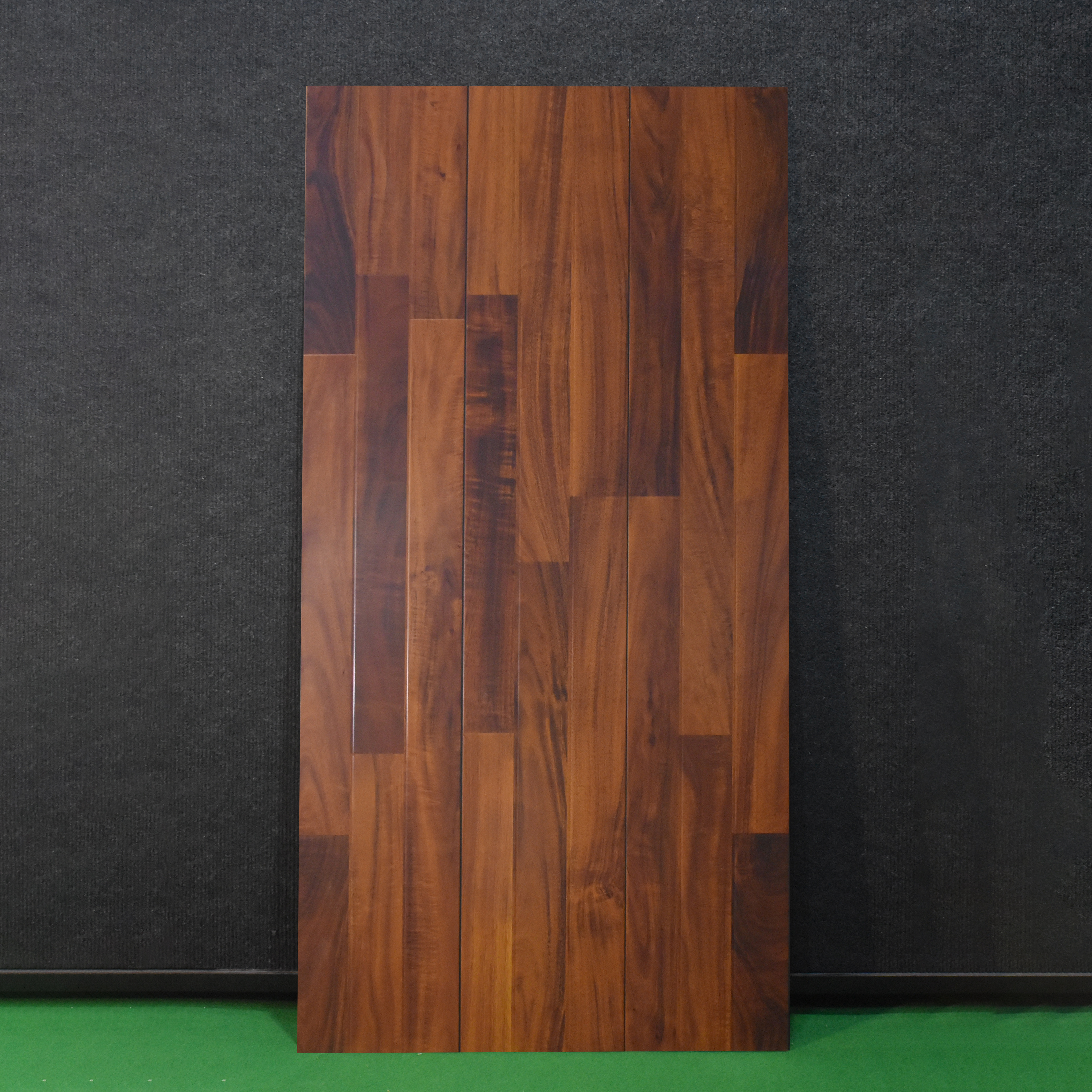 A close-up of a HDF Laminate Wood Floor Glossy Finish Gleam LF 00261 | 4 ft x 8 inch x 8 mm | AC4 Grade | Arc Click With Wax Coating | U Groove | Suitable for Flooring, Living Room, Bedroom available at Material Depot in Bangalore