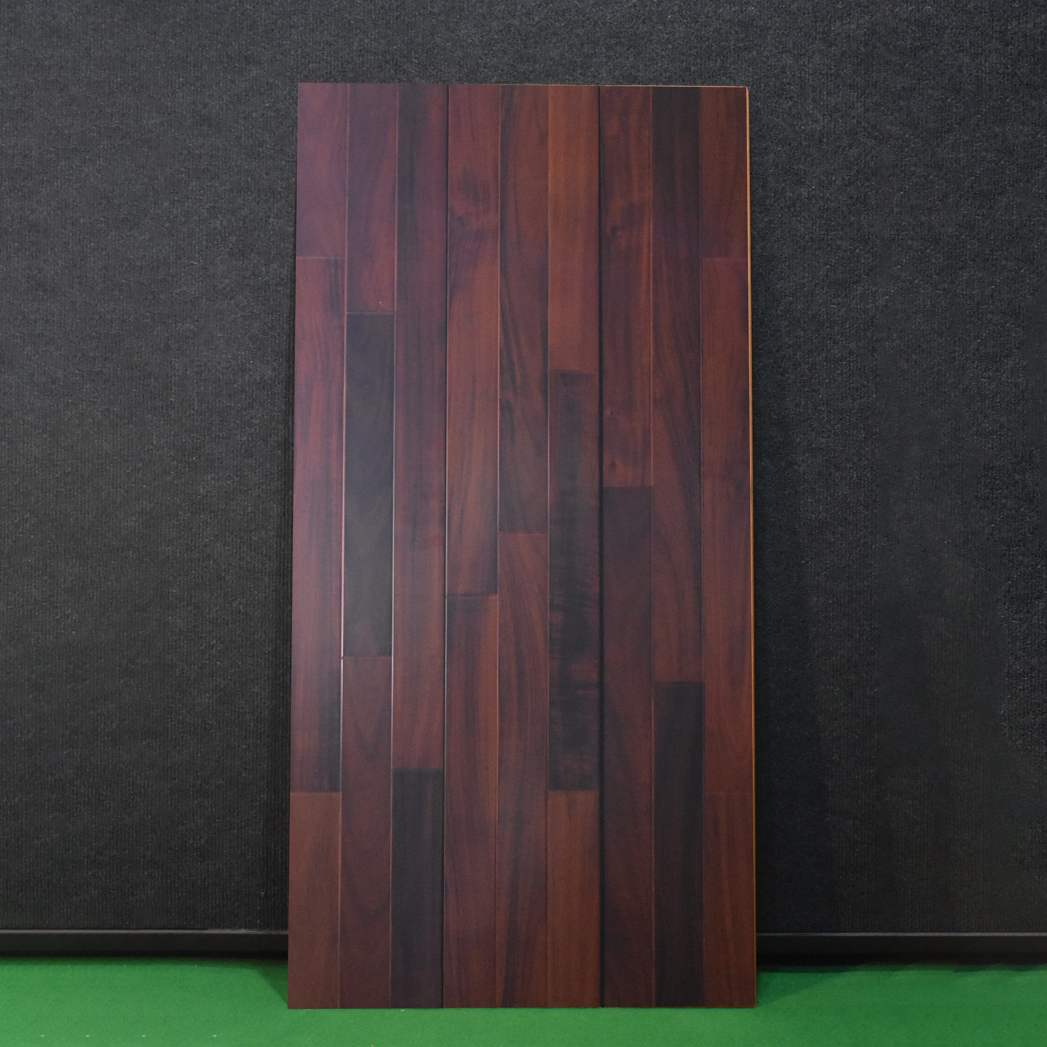 A close-up of a HDF Laminate Wood Floor Glossy Finish Gleam LF 00264 | 4 ft x 8 inch x 8 mm | AC4 Grade | Arc Click With Wax Coating | U Groove | Suitable for Flooring, Living Room, Bedroom available at Material Depot in Bangalore