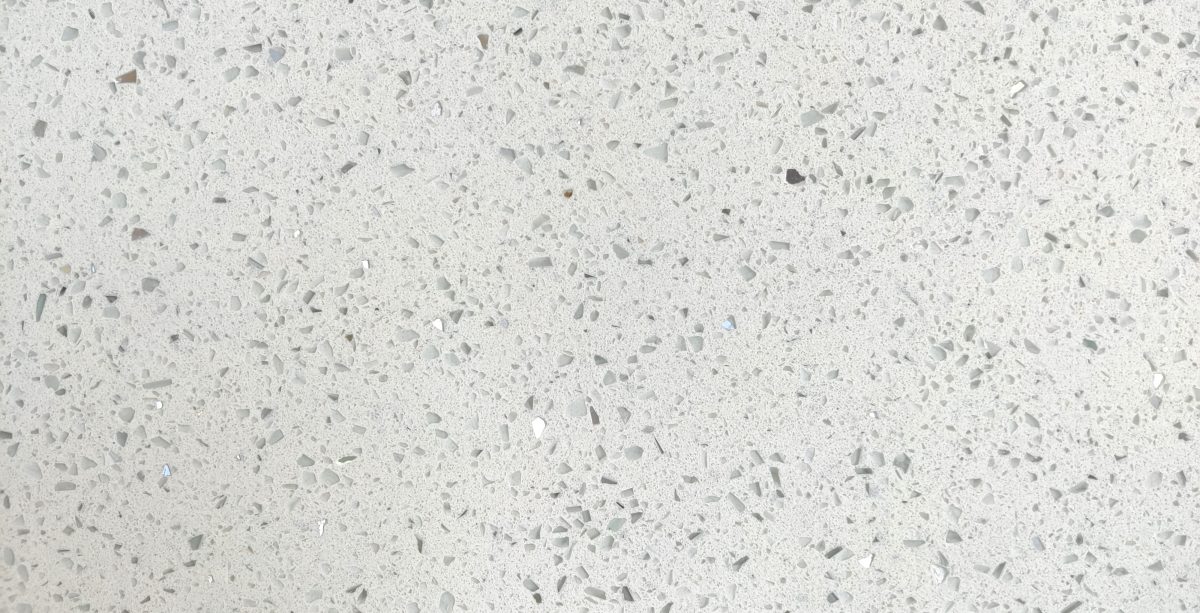 A close-up of aQR 00087 Elegant Series White Blizzard 3276x1651 mm Polished Finish Quartz - 20 mm (10 Years Warranty) available at Material Depot in Bangalore