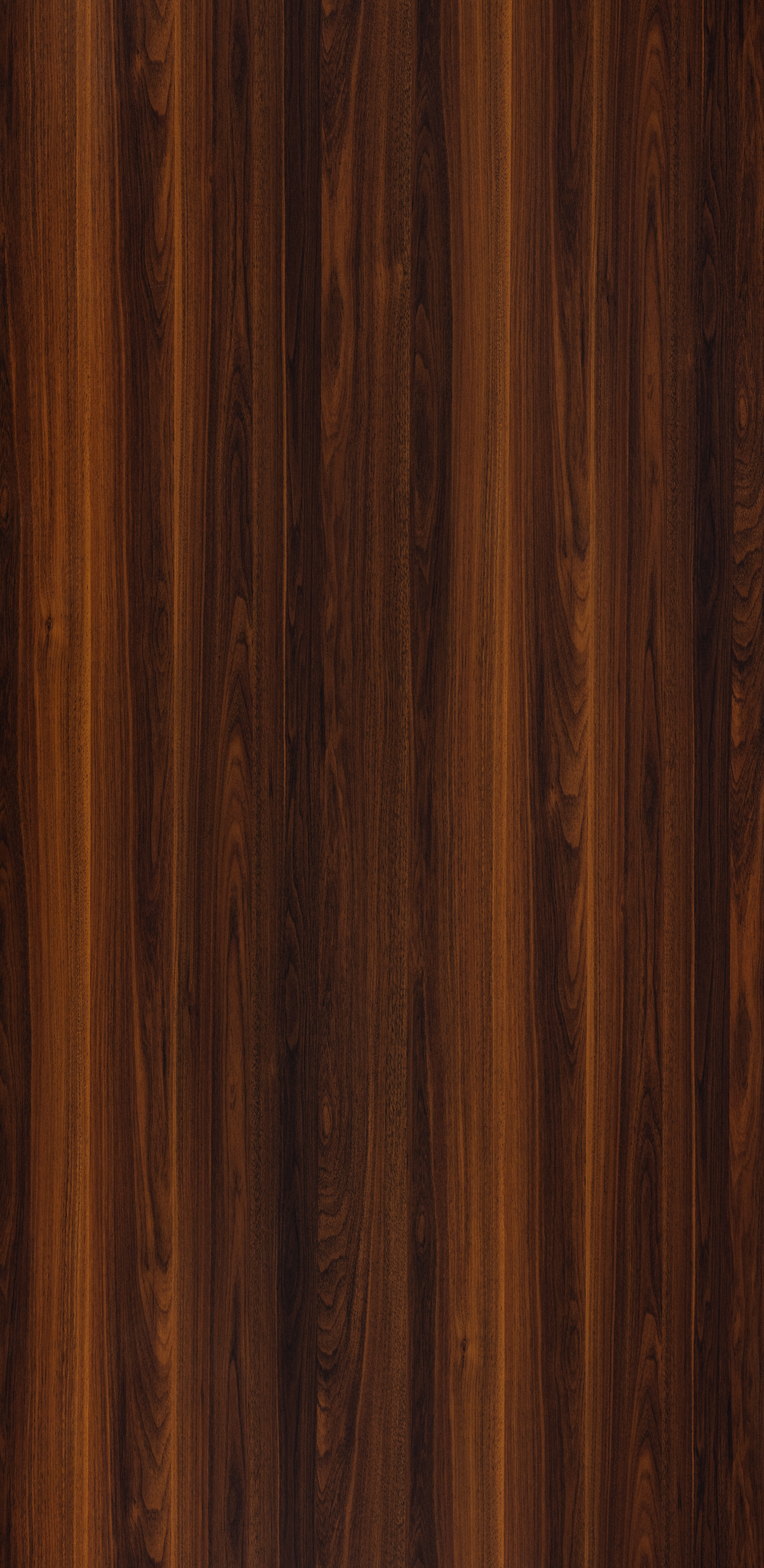 A close-up of a Brown 0179 SPG Columbian Walnut with a High Gloss finish Decorative Laminate available at Material Depot in Bangalore