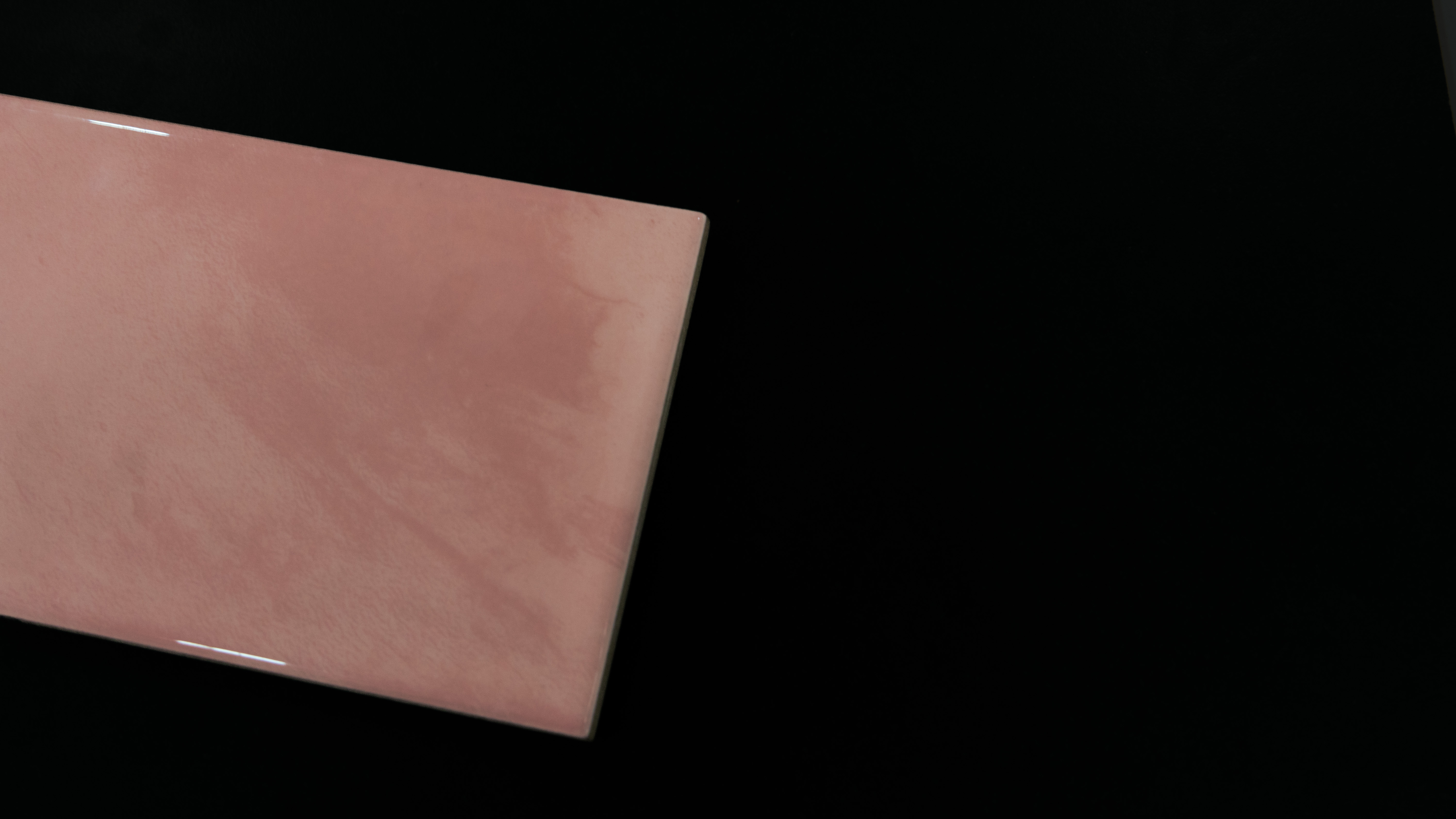 A close-up of a TL 03800 Pink 300x100 mm Glossy Finish Ceramic Wall  Subway Tile - 10 mm  with a Glossy finish available at Material Depot in Bangalore