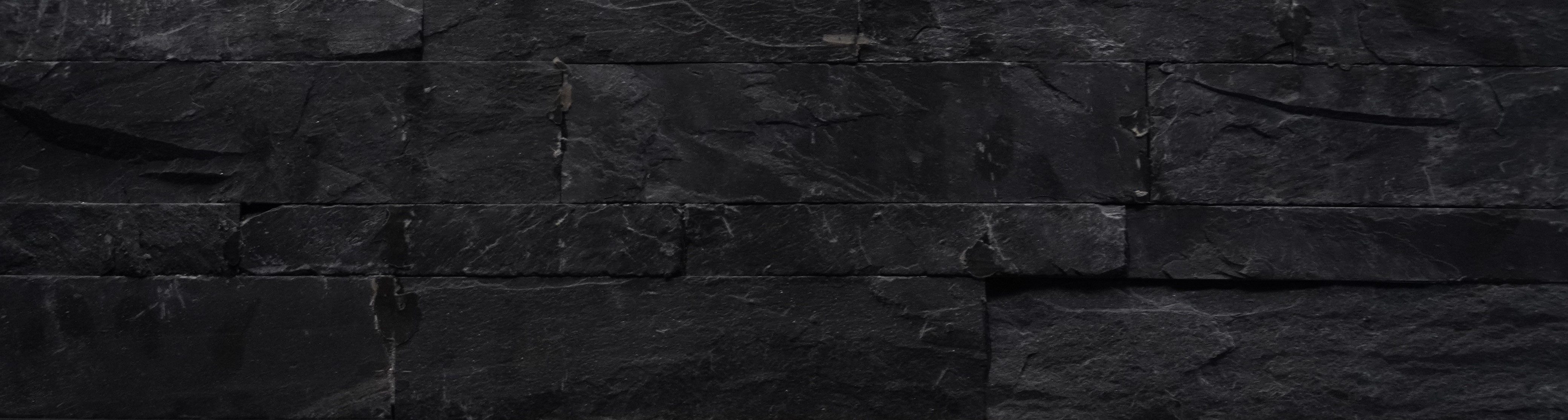 A close-up of a 1008 Jack Black 609.6x152.4 mm Wall Cladding available at Material Depot in Bangalore