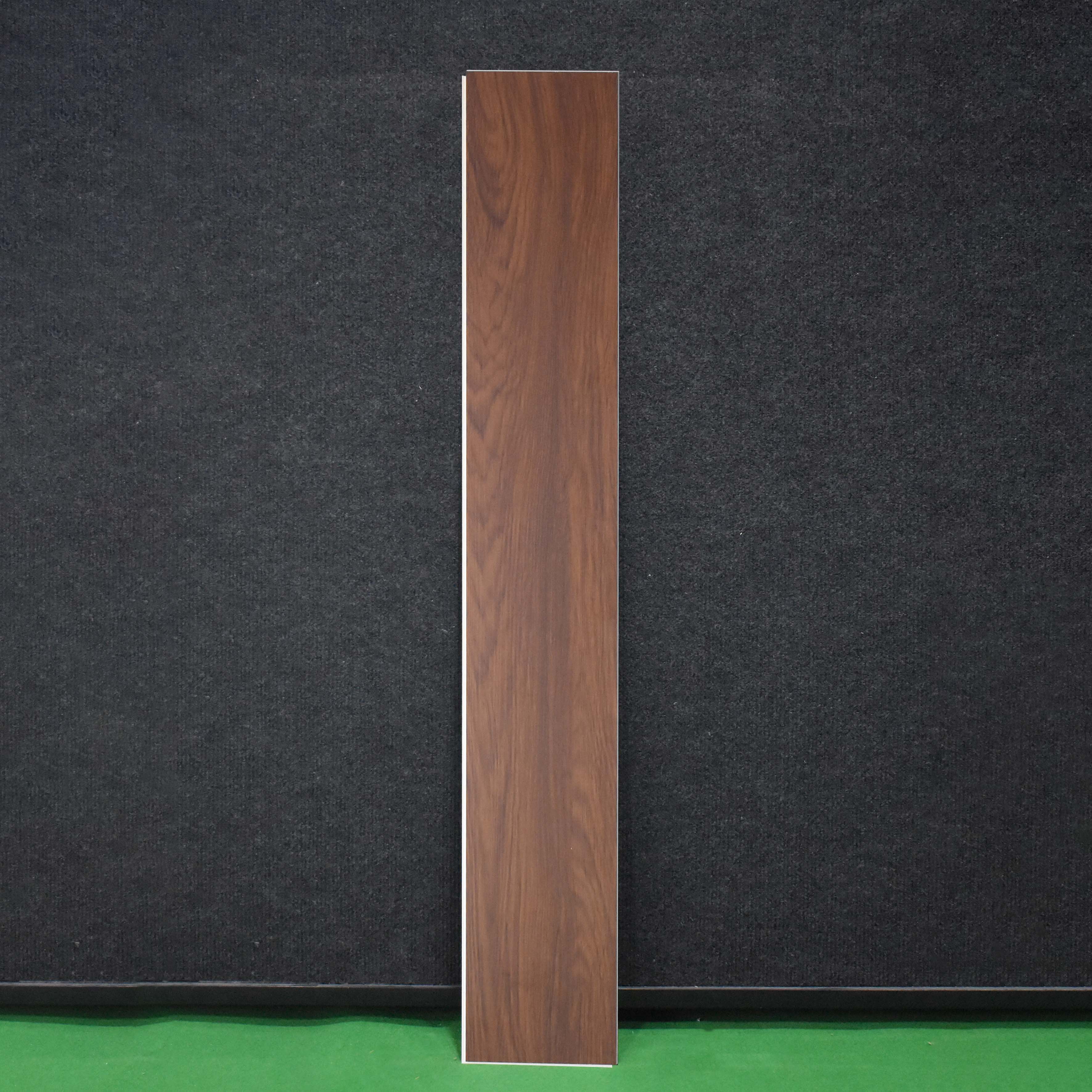 A close-up of a SPC Floor Walnut Royale Texture Finish Timberline SP 00081 | 4 ft x 7 inch x 5 mm | UV Coating IXPE Backing Layer | Suitable for Flooring, Living Room, Bedroom available at Material Depot in Bangalore