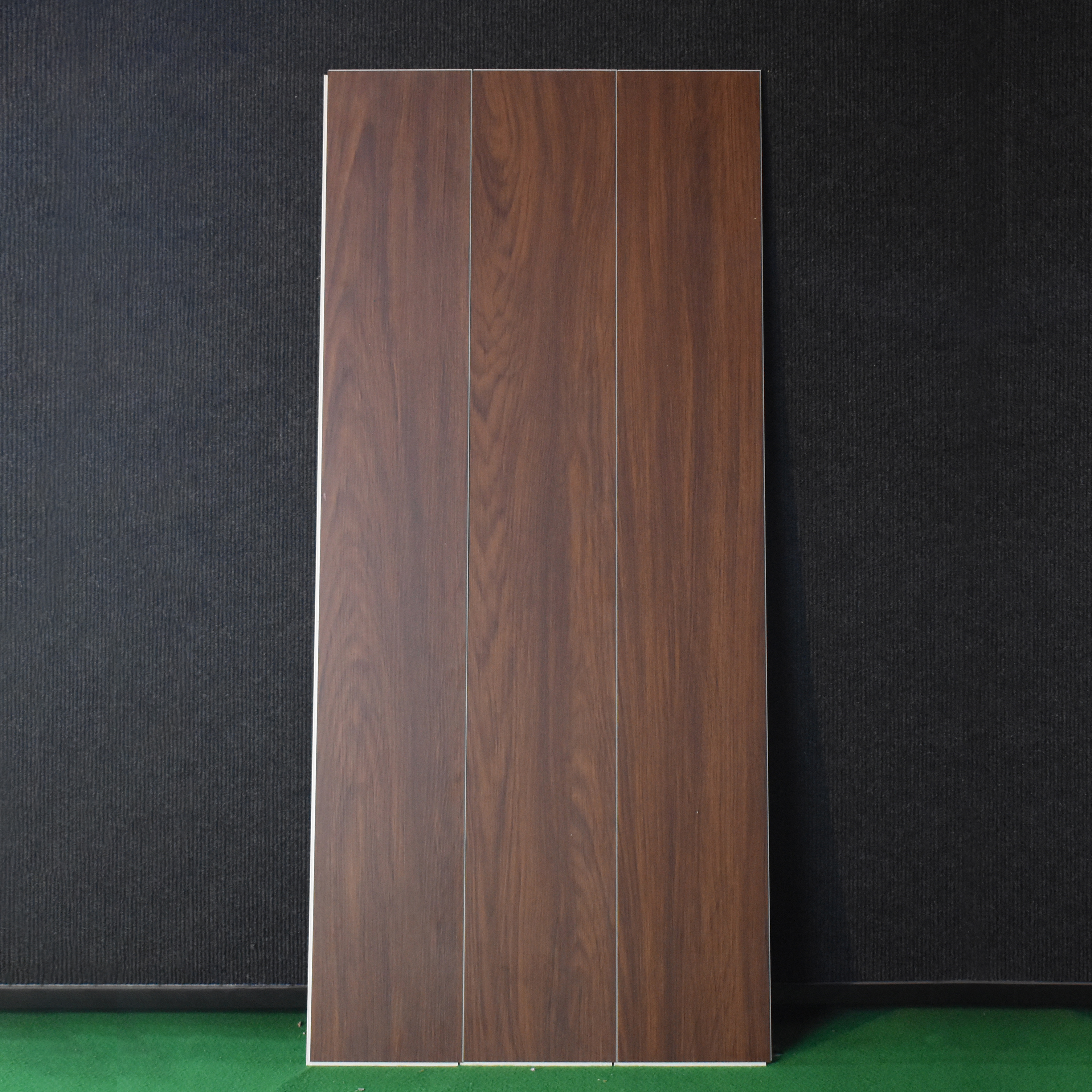 A close-up of a SPC Floor Walnut Royale Texture Finish Timberline SP 00081 | 4 ft x 7 inch x 5 mm | UV Coating IXPE Backing Layer | Suitable for Flooring, Living Room, Bedroom available at Material Depot in Bangalore