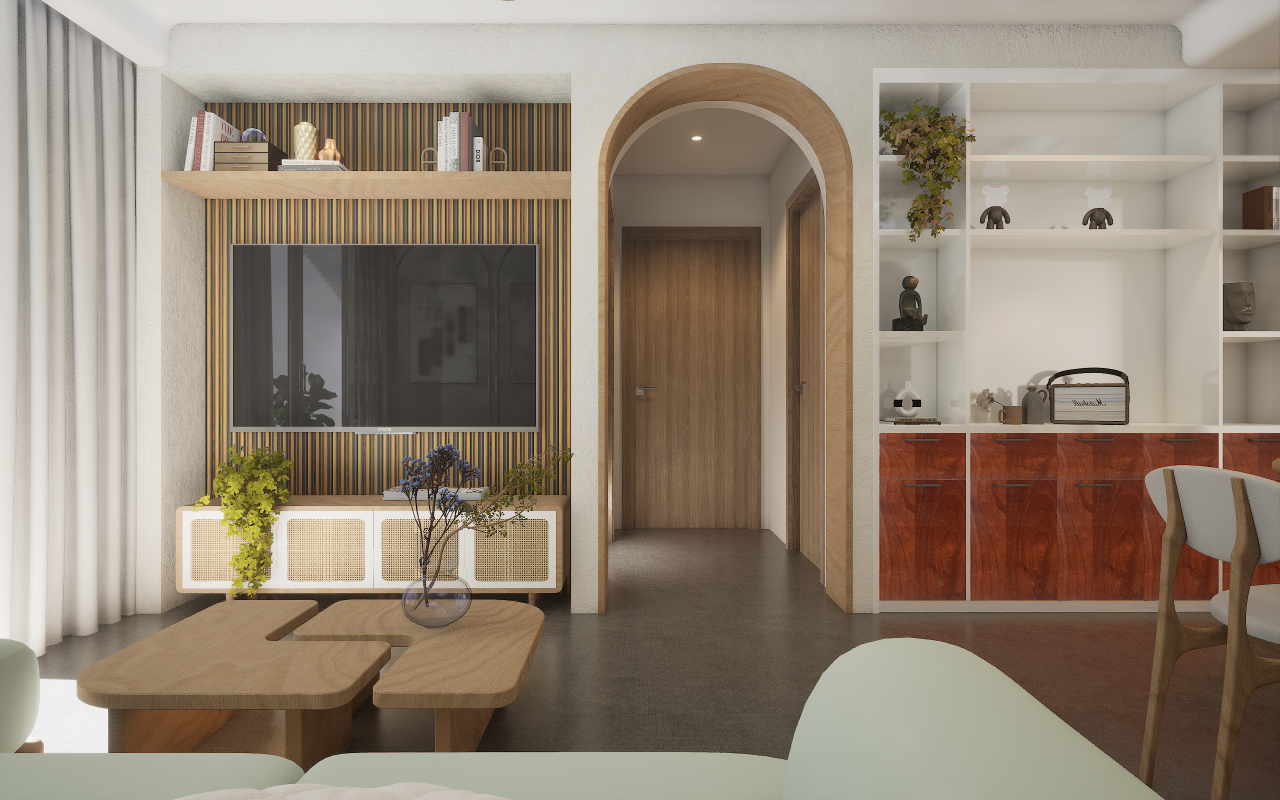 A living room with a wooden bookshelf, white sofa, and coffee table, accented with greenery and a modern archway leading to the kitchen.