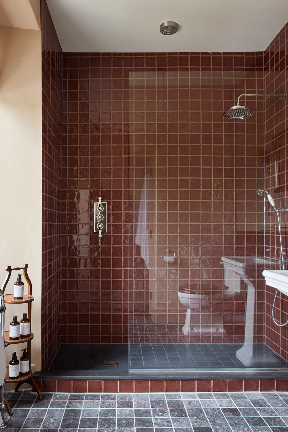 Chic and Modern Shower Space with Rich Burgundy Tiles and Minimalist Design | Material Depot