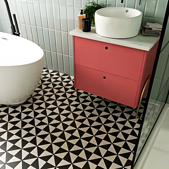 Chic Contrast: Coral Vanity and Monochrome Geometric Tile Bathroom | Material Depot