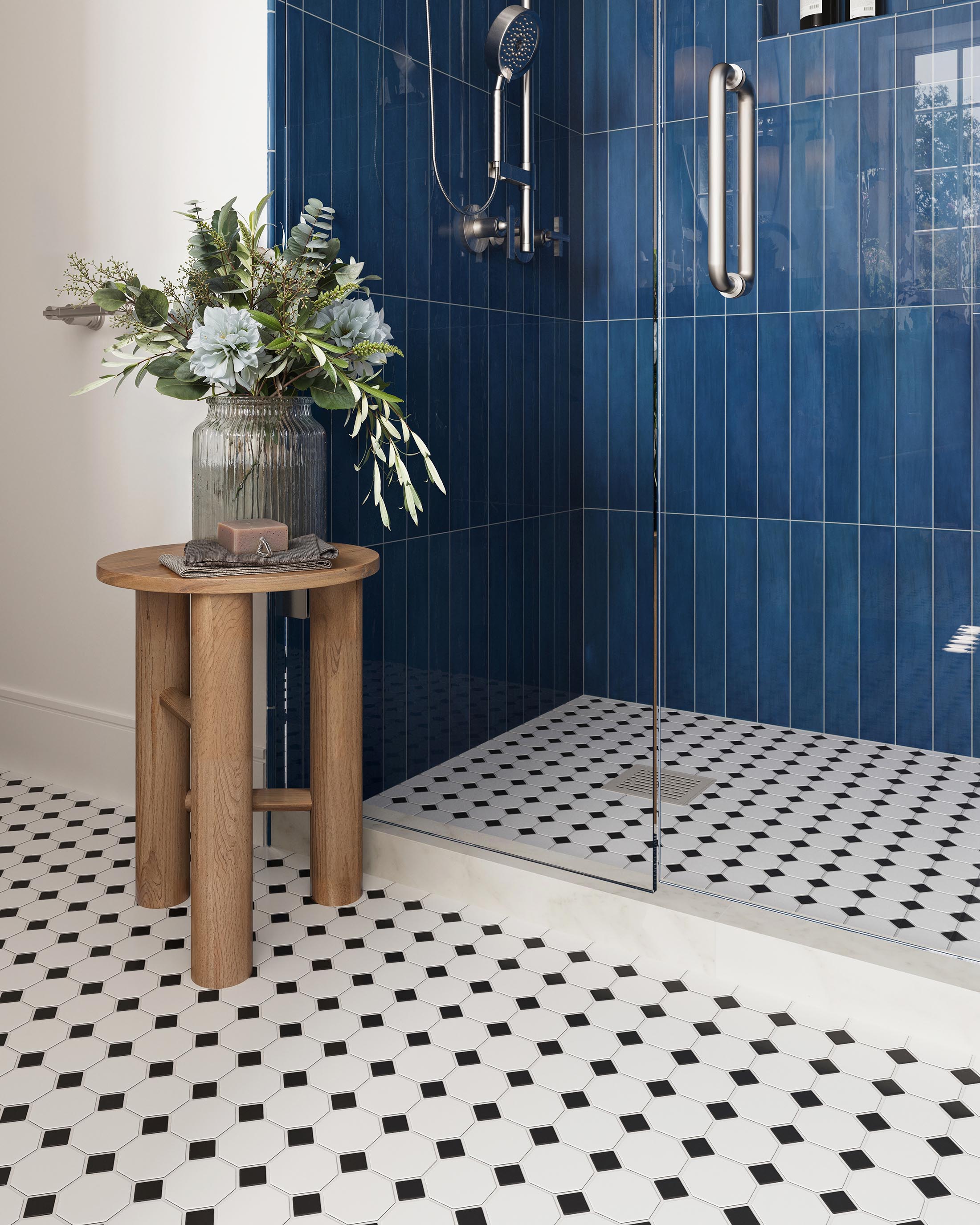 Dramatic Blue Tiled Shower with Black and White Patterned Floor and Modern Fixtures | Material Depot