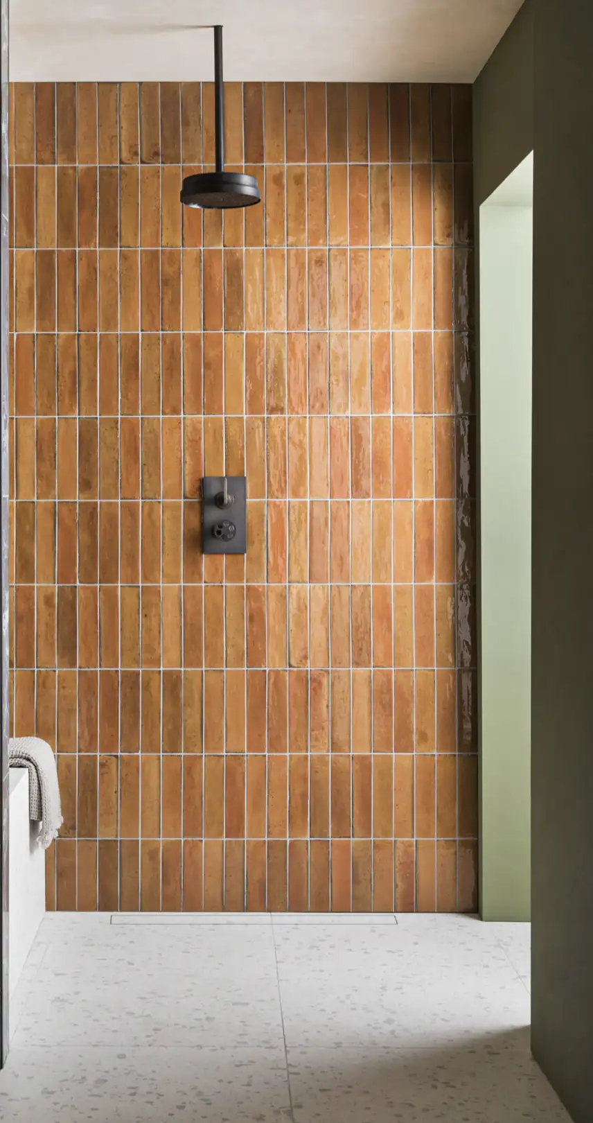 Title: "Earthy Terracotta Vertical Tiles in Minimalist Shower Design" | Material Depot