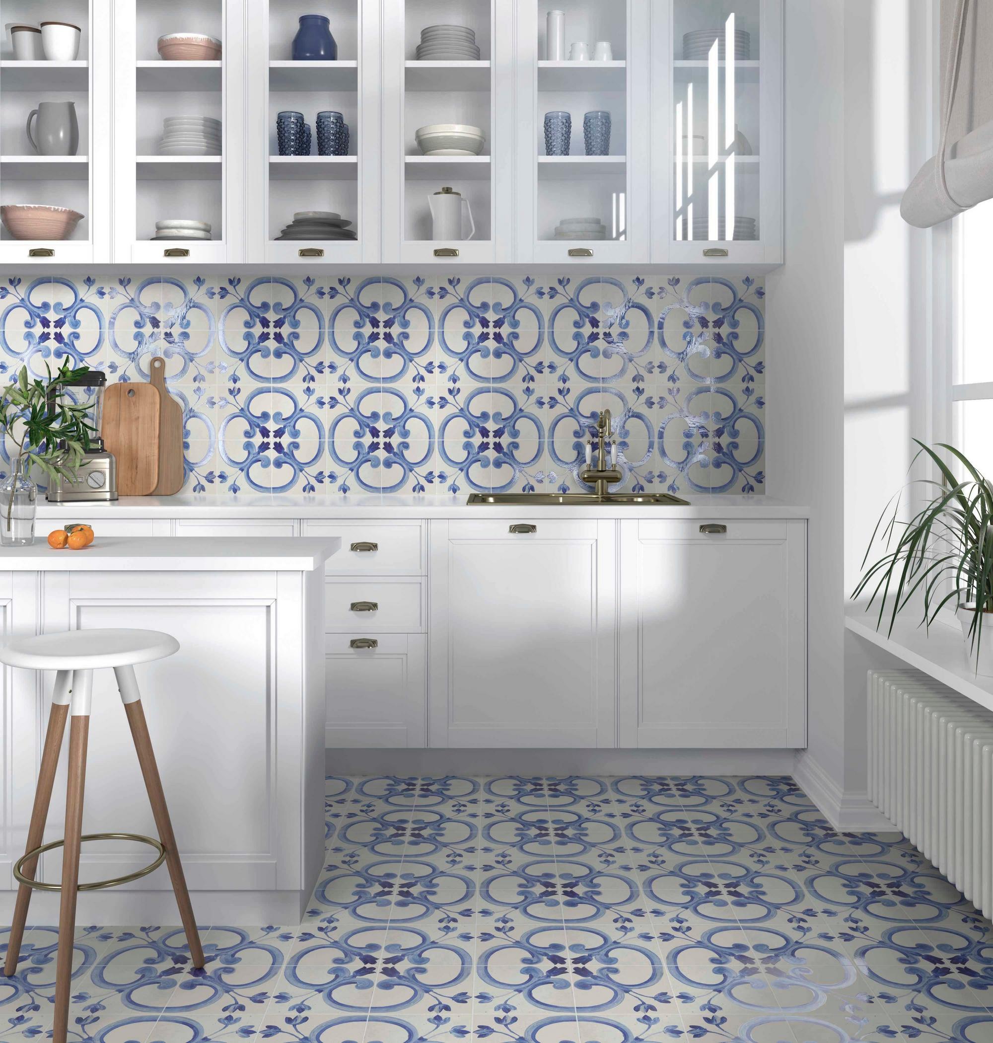 Blue designed tiles with white laminate and faucet