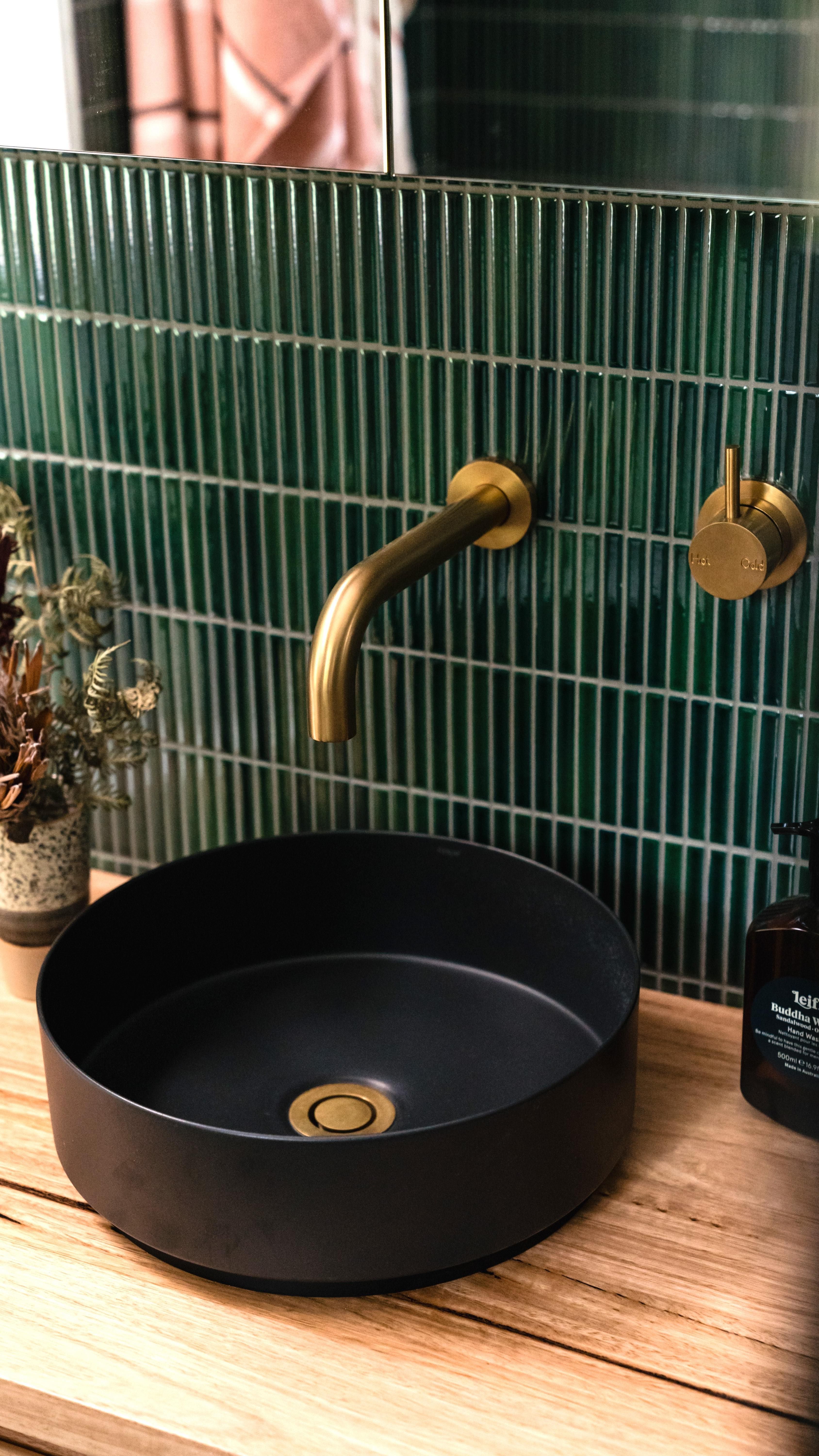 Modern Bathroom with Black Basin and Green Tiles | Material Depot