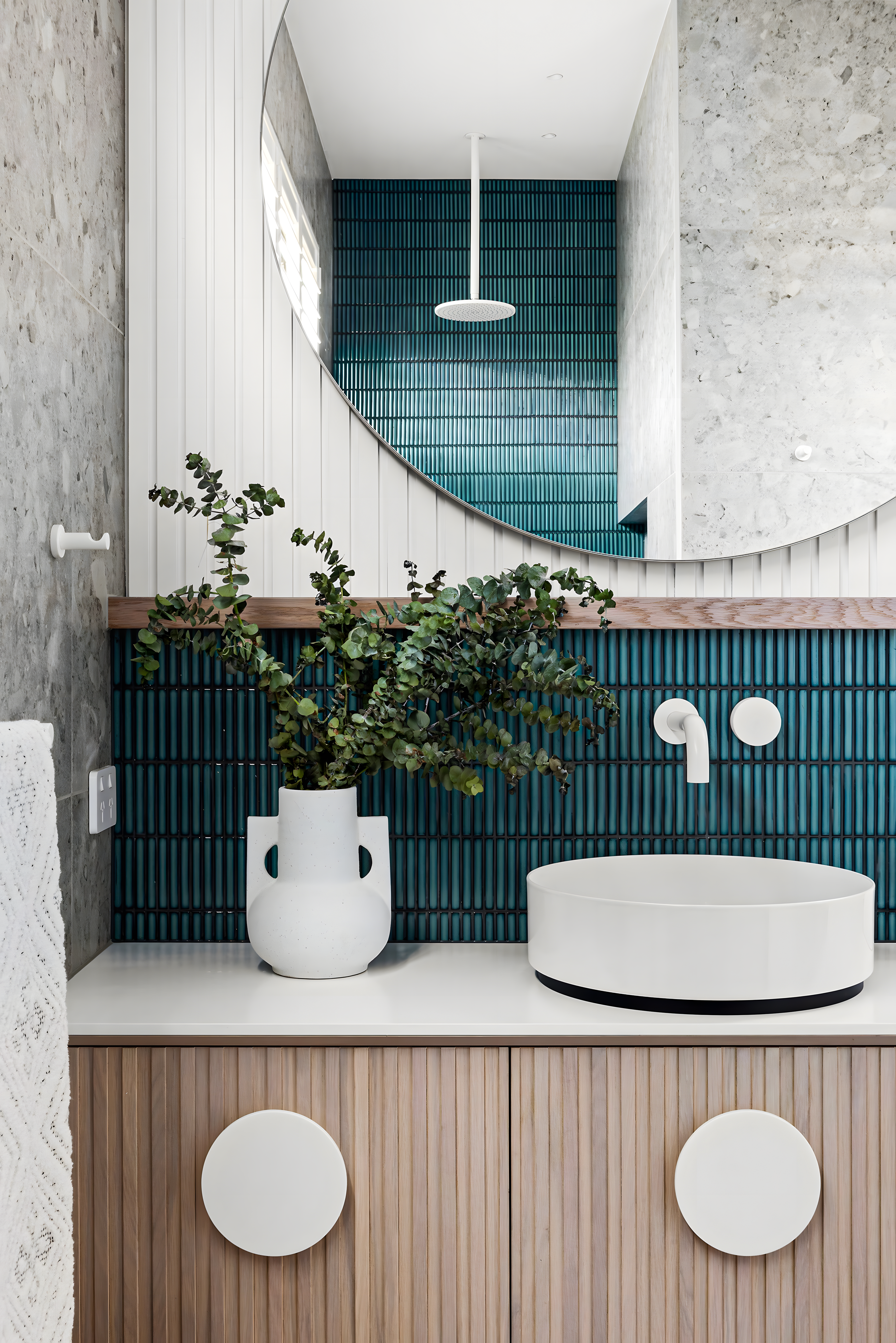 Modern Bathroom with Teal Subway Tiles and Circular Mirror | Material Depot