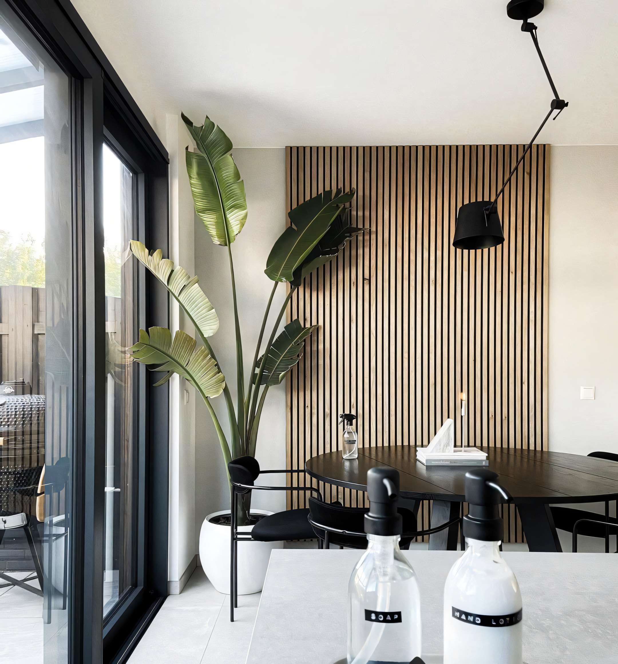 Modern Scandinavian Living Room with Bird of Paradise Plant and Wood Accents | Material Depot