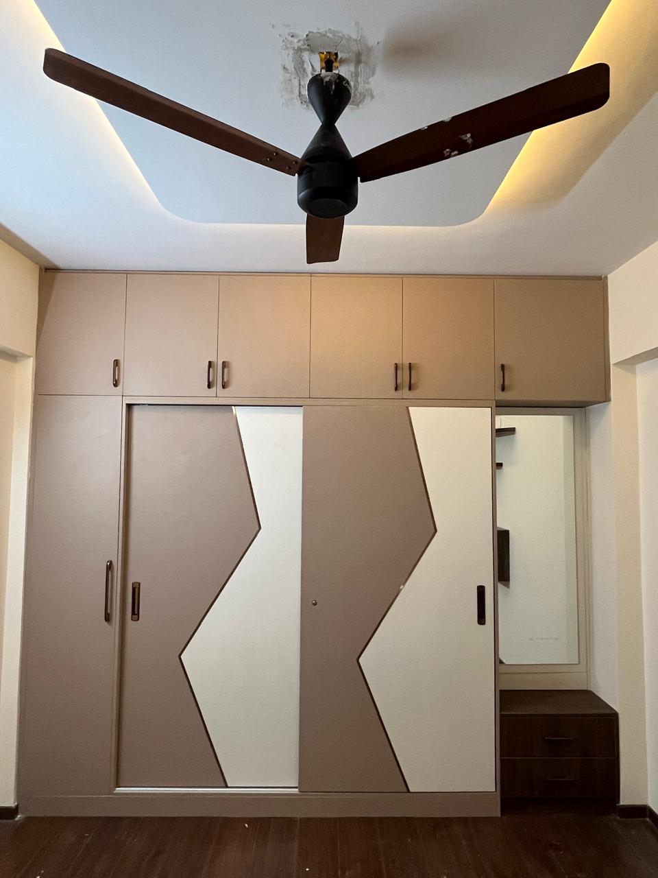 Modern Wardrobe with Bold Geometric brown Accents in Bengaluru | Material Depot