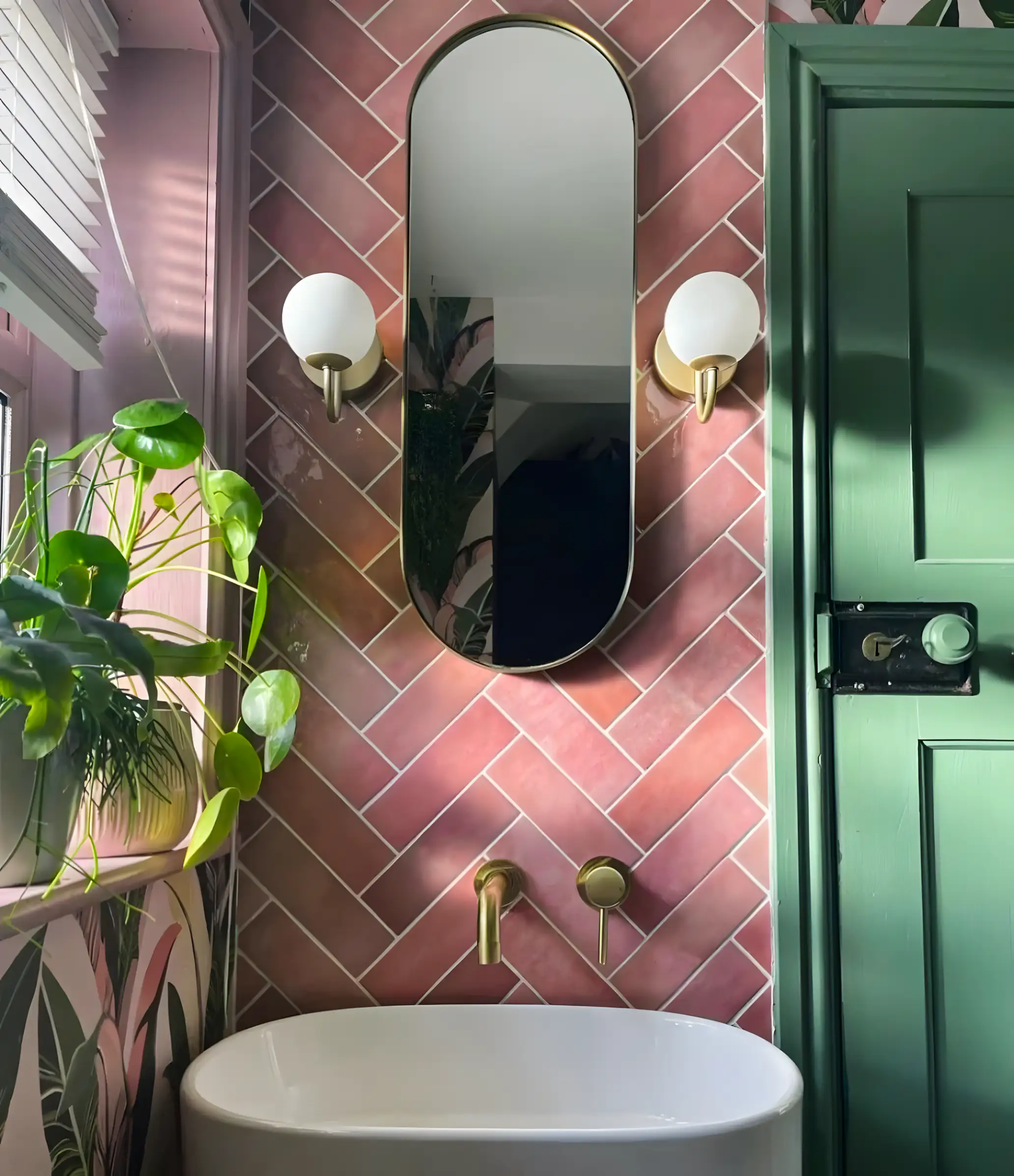 Pink and Green Bathroom with Herringbone Tiles and Gold Accents | Material Depot