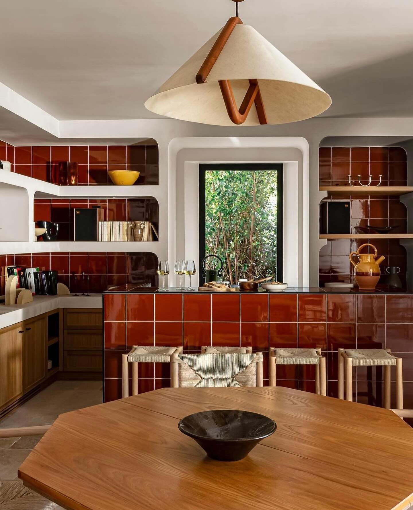 Stylish Dining Area with Bold Terracotta Tile Accents and Natural View | Material Depot