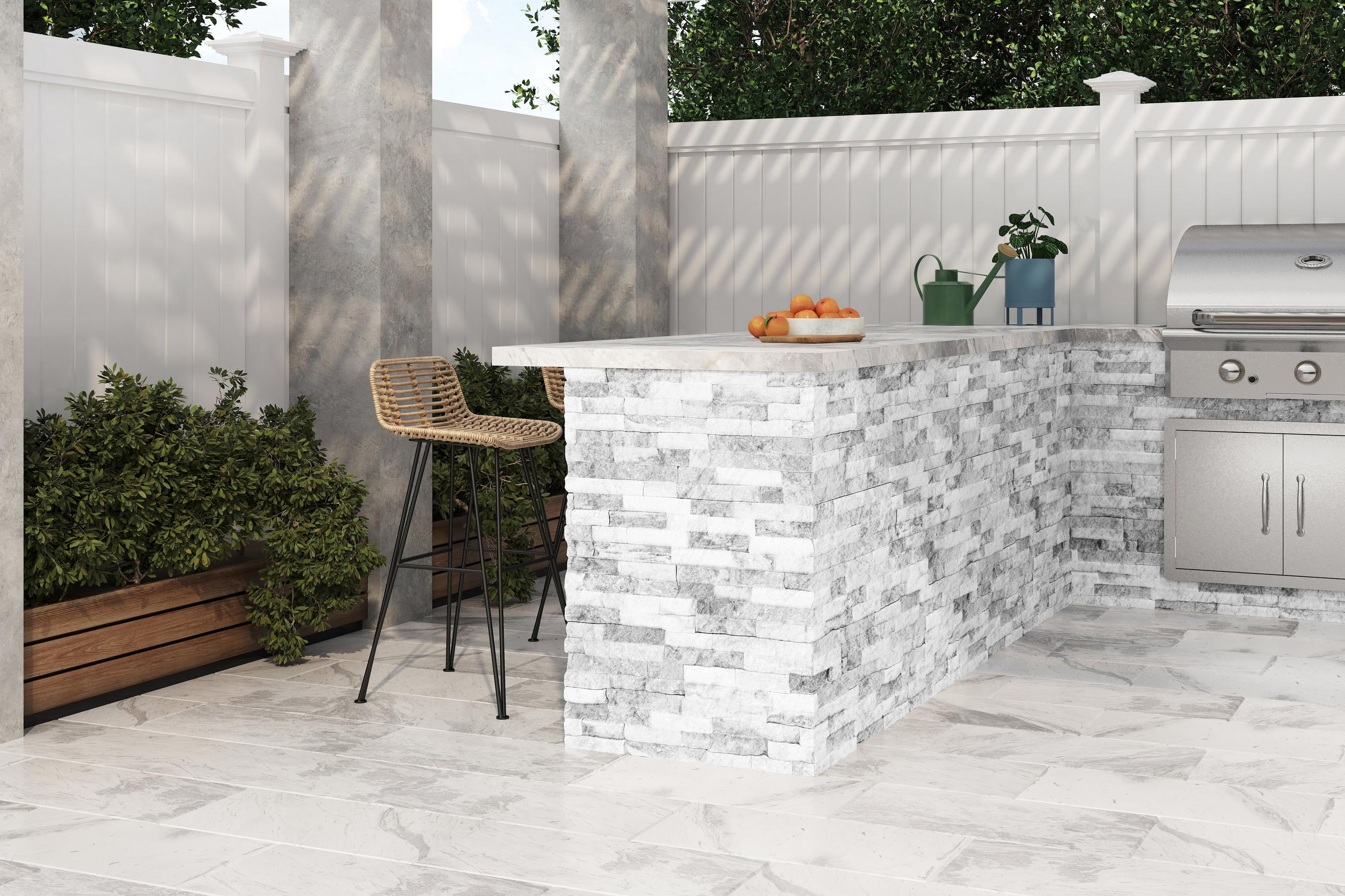 Outdoor space with marble floor tiles and patterned stone tiles