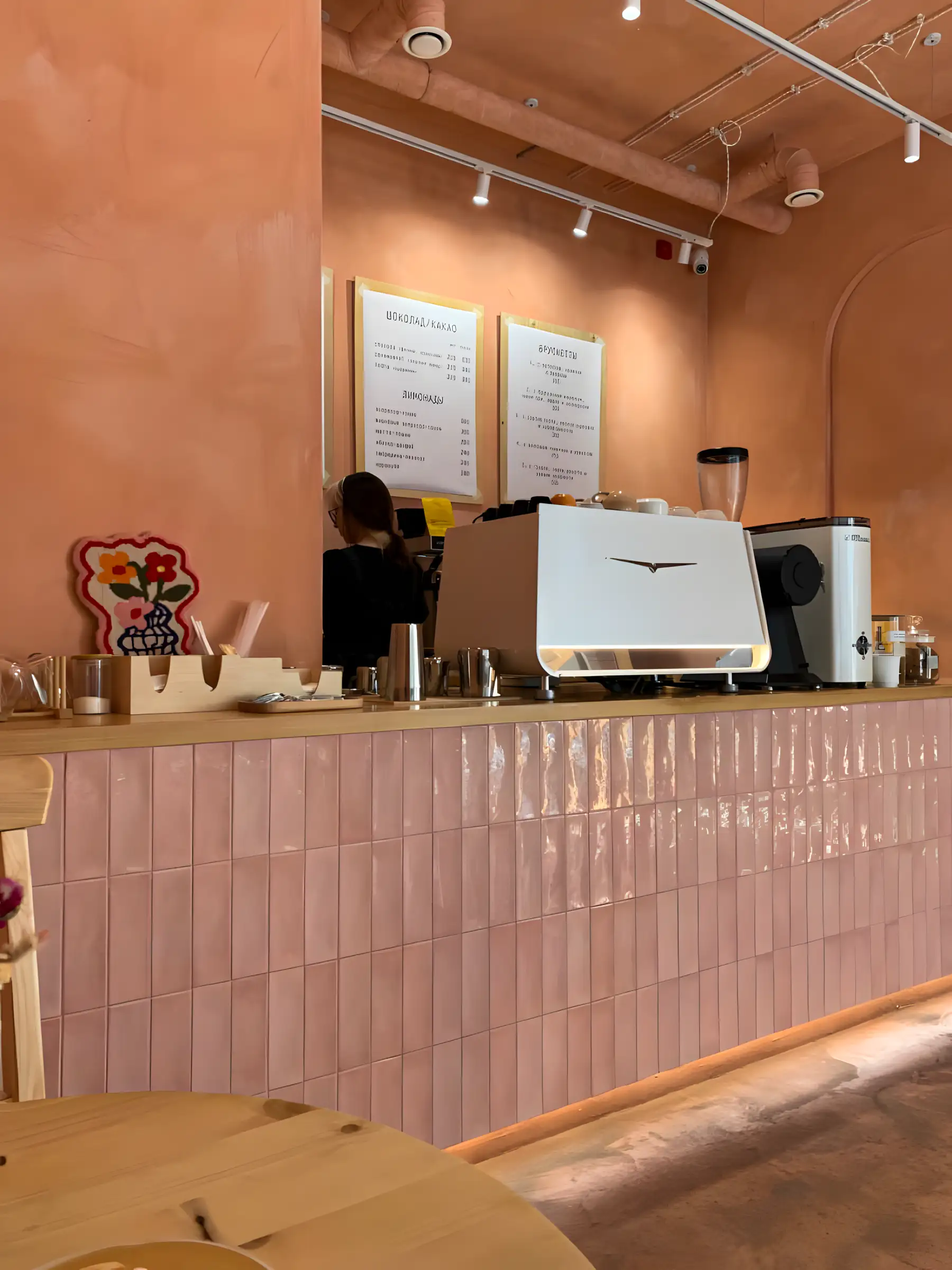 Subtle Charm: Pastel Pink Café Wall Design | Material Depot