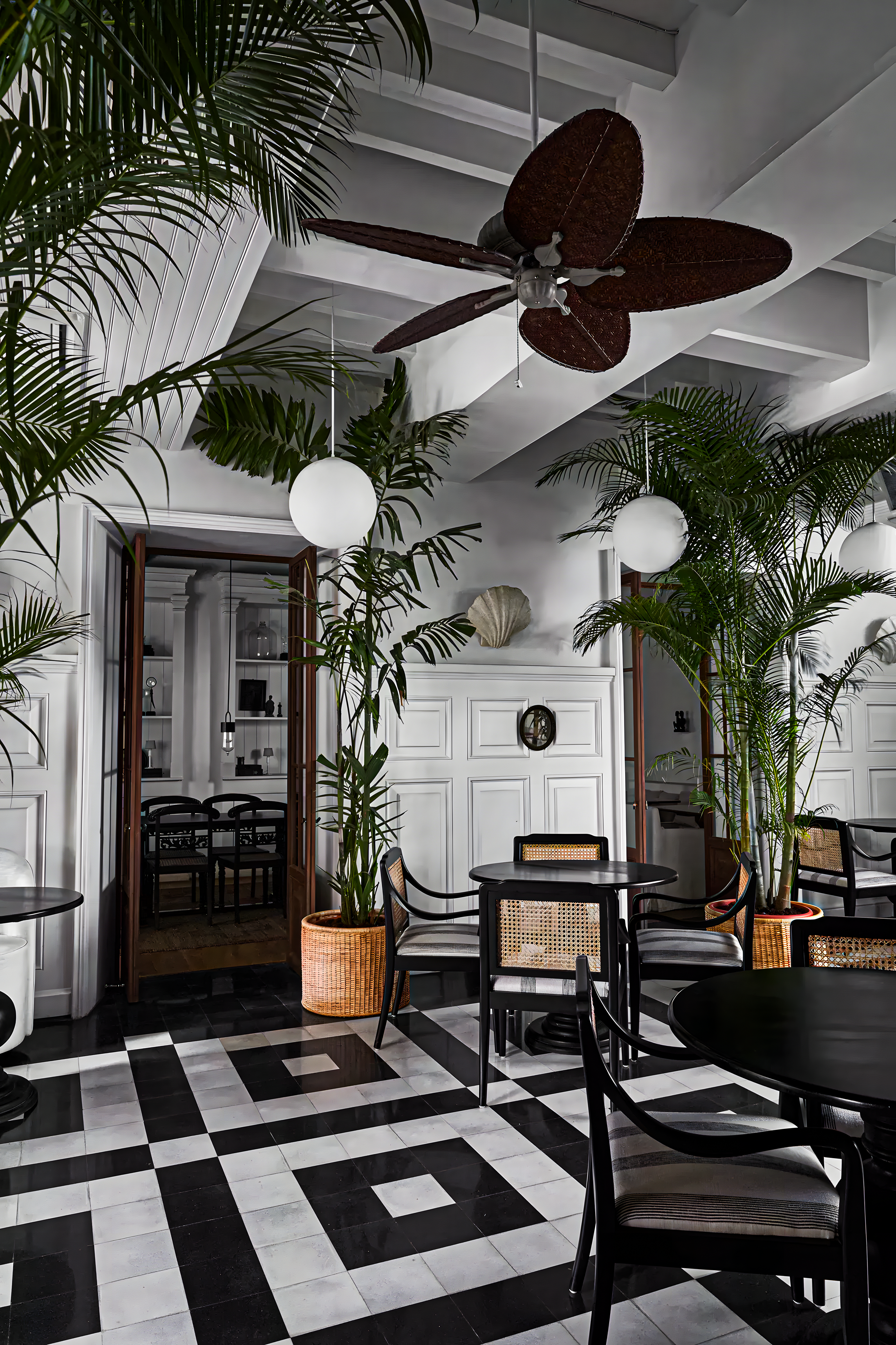 Tropical-Inspired Indoor Space with Black and White Checkerboard Tiles | Material Depot