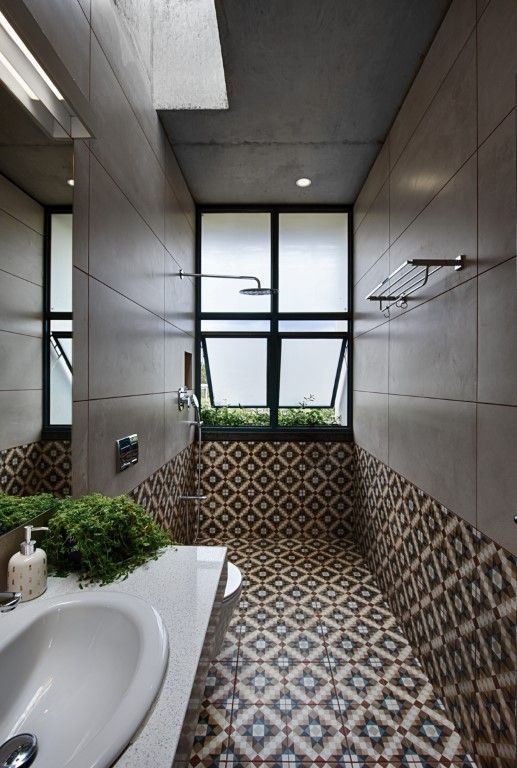 Urban Oasis: Sleek Modern Bathroom with Industrial Elements and Patterned Tile Accents | Material Depot