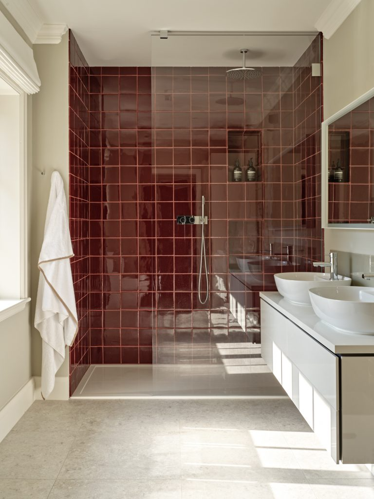 Warm Luxury in a Contemporary Setting: Rich Red Tiles in a Sunlit Bathroom Design | Material Depot